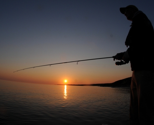Fiskeri ved solnedgang
